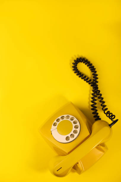 istock yellow bright retro telephone 1605589648