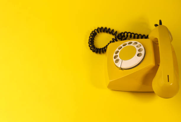 istock yellow bright retro telephone 1605589649