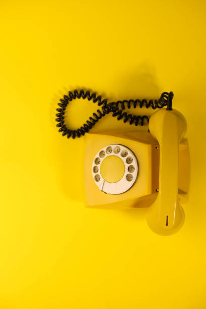 istock yellow bright retro telephone 1605589873