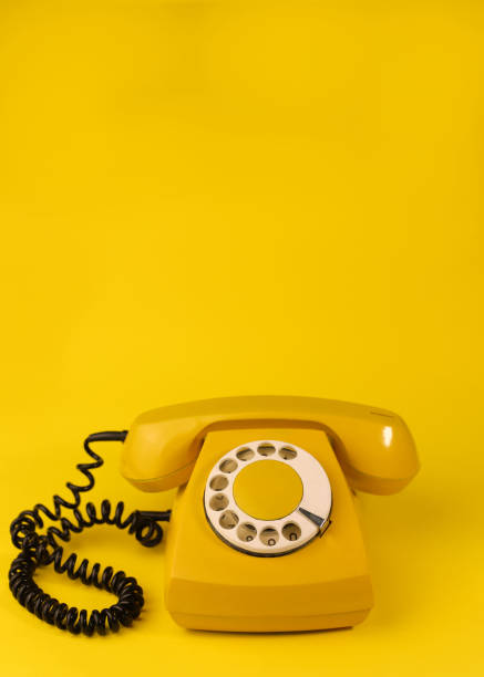 istock yellow bright retro telephone 1605590163
