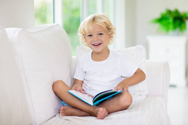 istock Child reading book. Kids read books. 1605604407