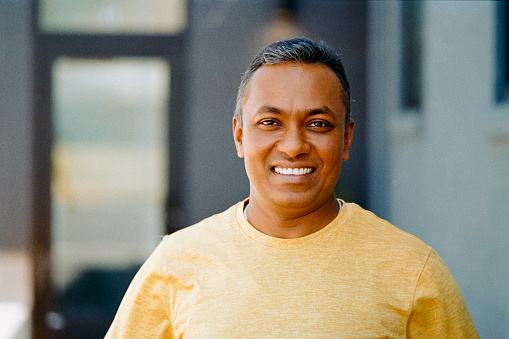 A natural light portrait of an Indian man Taken on 35mm film and scanned into digital format.
