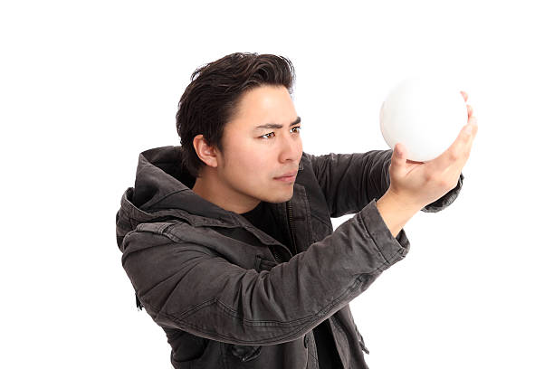 istock Man looking up into a glass ball 160563698