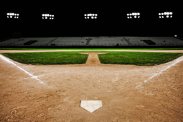 Baseball diamond at night Baseball diamond at night base sports equipment photos stock pictures, royalty-free photos & images