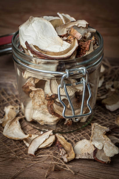 istock Dried mushrooms in jar. 1605660887