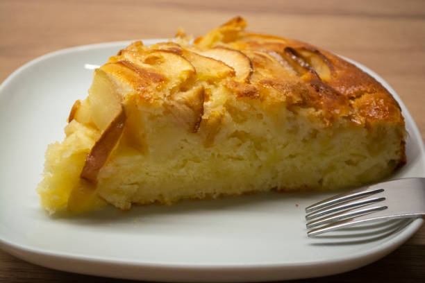 istock A piece of apple pie on a white plate with a fork 1605662534