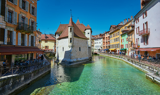 A landscape around Le Palais de I'Île. It is a medieval castle and prison in the middle of the Thiou Canal in Annecy, France.