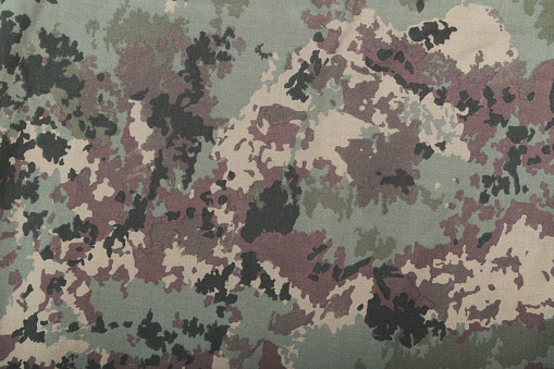 Textile camouflage. Abstract background and texture.