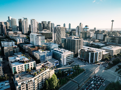 Aerial footage above Seattle, Washington, USA, the evening sun casting deep shadows on the city.