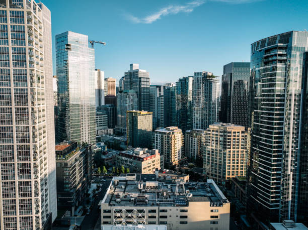 Aerial footage above Seattle, Washington, USA, the evening sun casting deep shadows on the city.