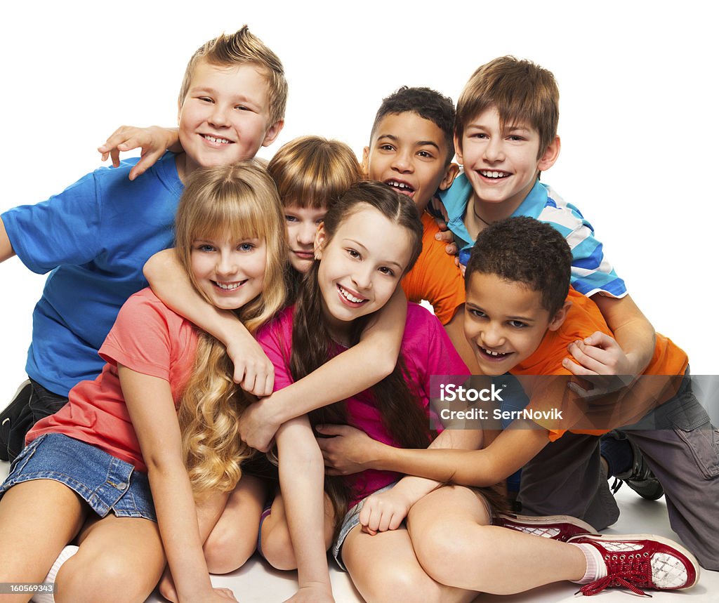 Group of happy smiling kids Group of happy smiling kids sitting together and playing - boys and girls black and Caucasian African Ethnicity Stock Photo
