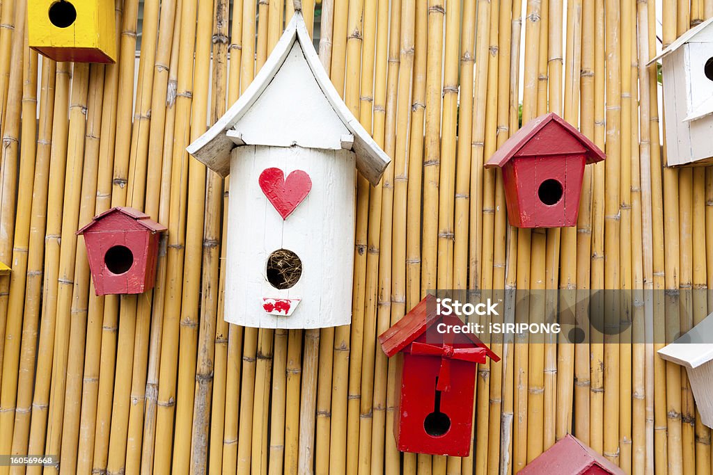 Colorful collection of birdhouses Colorful collection of birdhouses on wood wall Animal Nest Stock Photo