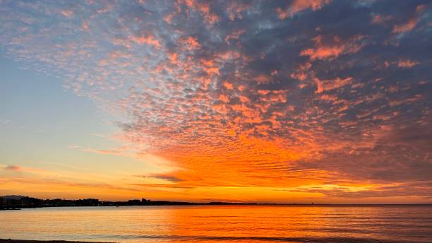 istock Sky and clouds in flames of red at sunset 1605712057