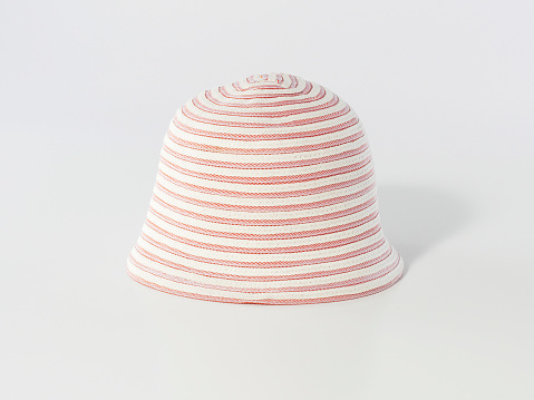 Pink and white sun hat on white background