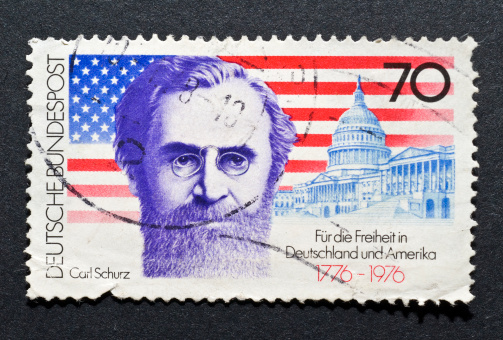 German post stamp with carl schurz with an american flag. for freedom in Germany and America written post.