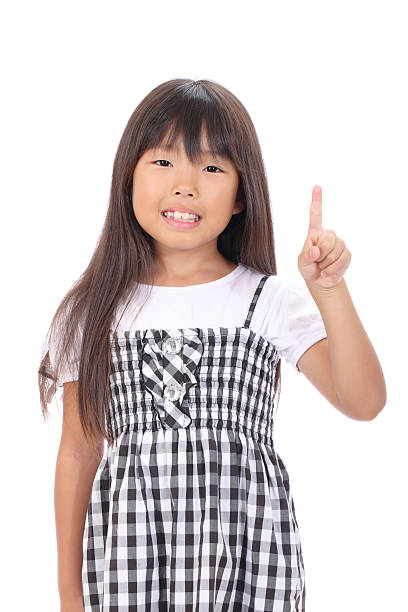 istock little asian girl pointing up 160578789