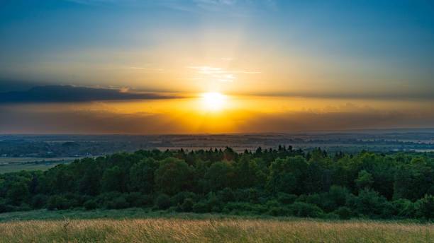 istock Sunrise over a wide rural scene 1605792489