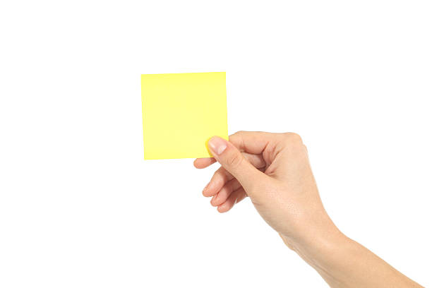 istock Woman hand holding a yellow notepaper 160580357
