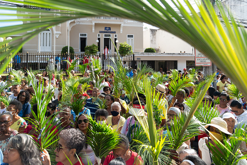 Salvador, Bahia, Brazil - April 02, 2023: Hundreds of Catholic faithful are seen during the open-air Mass on Palm Sunday in the city of Savador, Bahia.