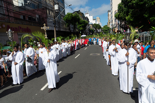 Salvador, Bahia, Brazil - April 02, 2023: Catholic church priests are participating in the Palm Sunday procession in the city of Salvador, Bahia.
