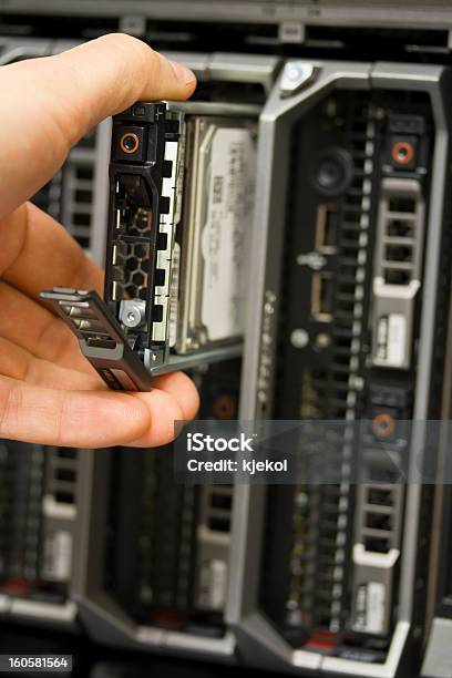 Removes Hard Drive Stock Photo - Download Image Now - Hard Drive, Data Center, Inserting