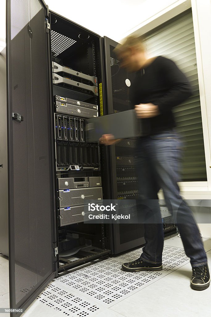 Server Rack Loading Man Loading Components Into A Server Rack Stock Photo - Download Image ...