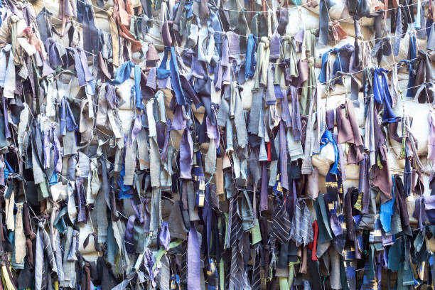 istock Homemade camouflage net from fabric strips 1605816936