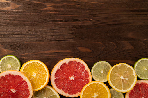 Grapefruit, orange, lime, lemon cut into slices. Flat lay.