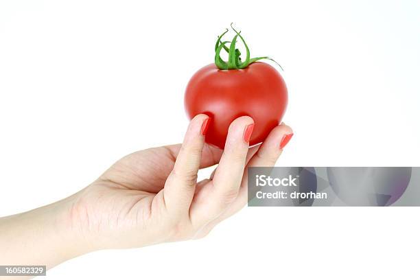 Foto de Tomate Em Uma Mão Da Mulher e mais fotos de stock de Aberto - Aberto, Adulto, Alimentação Saudável