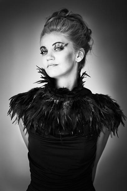 istock Portrait of blonde with feathers 160582338