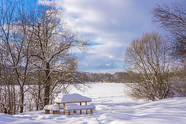 istock Wooden table under snow on a frozen lake. 160582421