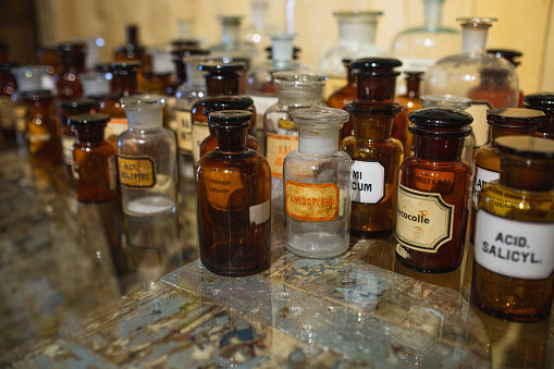 Glass jars in a pharmacy - vintage apothecary glassware for chemicals