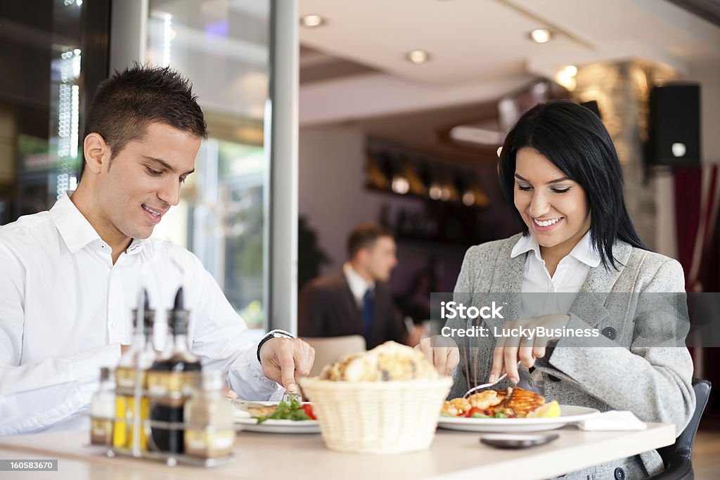 Business lunch restaurant people eating meal Business people enjoy lunch meal at restaurant management discussion Adult Stock Photo