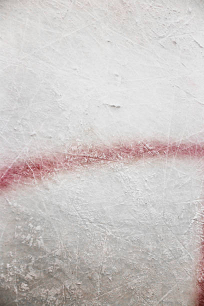 Red marking line on the ice of a hockey rink Red marking line on the ice of a hockey rink - puck faceoff circle - close up background of a scratch on the ice scuff marks photos stock pictures, royalty-free photos & images
