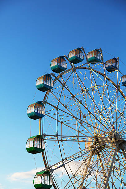istock Ferris wheel turns around under the blue sky 160585115