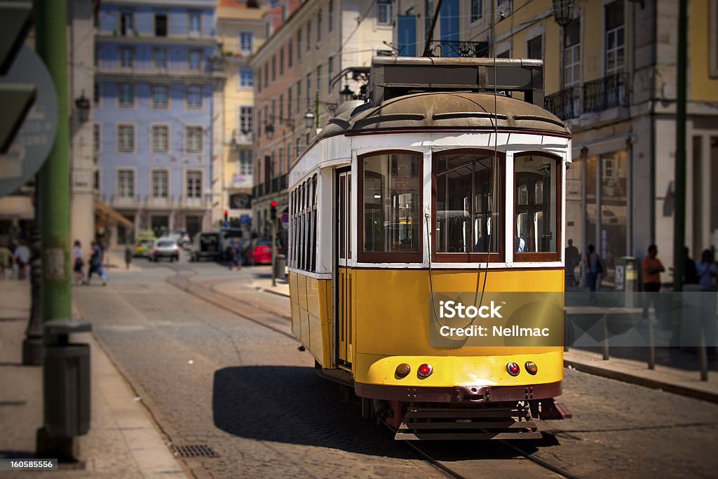 Old lisbon yellow tram on the street Old lisbon yellow tram on the street. Focus on the tram Cable Car Stock Photo