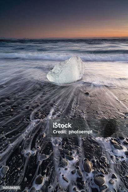 Iceberg On Beach At Sunrise Jokulsarlon Iceland Stock Photo - Download Image Now - Beach, Black Color, Blue