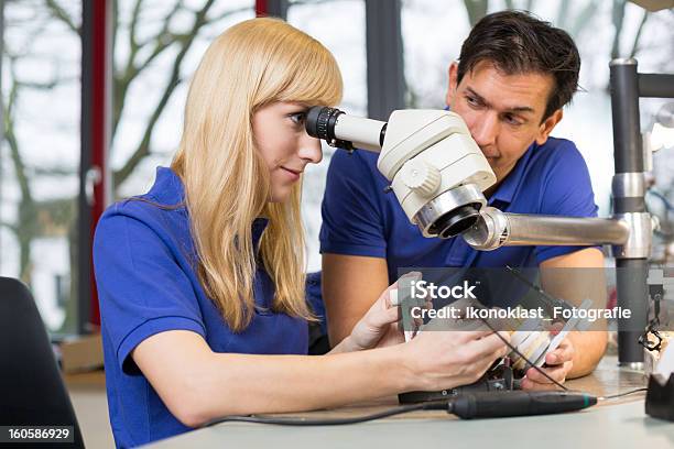 Dental Technicians Working On Mold Under A Microscope Stock Photo - Download Image Now