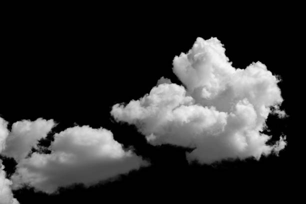 istock white fluffy clouds standing out against a black background and a blue sky 1605883192