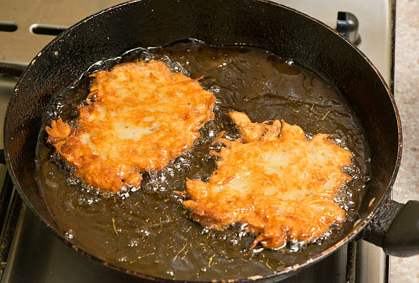 frying pancakes stock photo