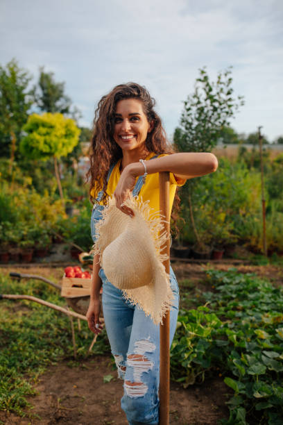 istock Woman posing in the garden 1605911794