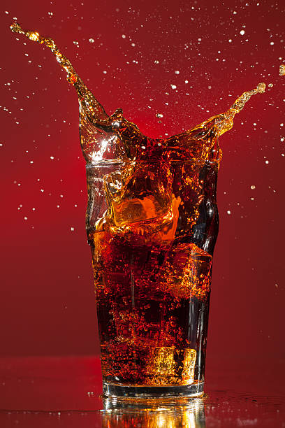 istock Full Pint of Cola with big ice cube splash 160592188