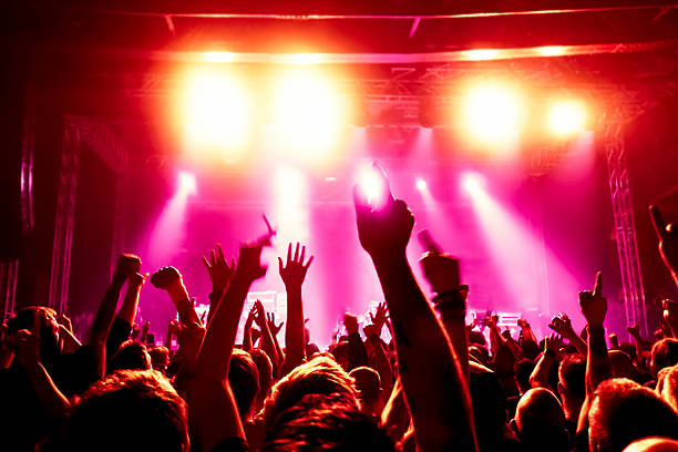 istock Concert crowd raising their arms in excitement 160592329
