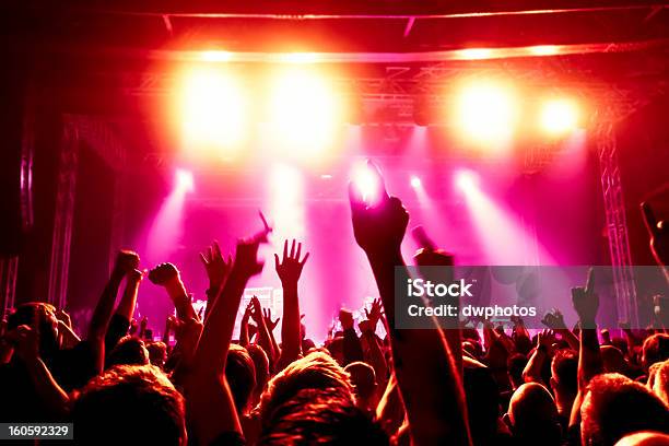 Concert Crowd Raising Their Arms In Excitement Stock Photo - Download Image Now - Admiration, Adolescence, Adulation