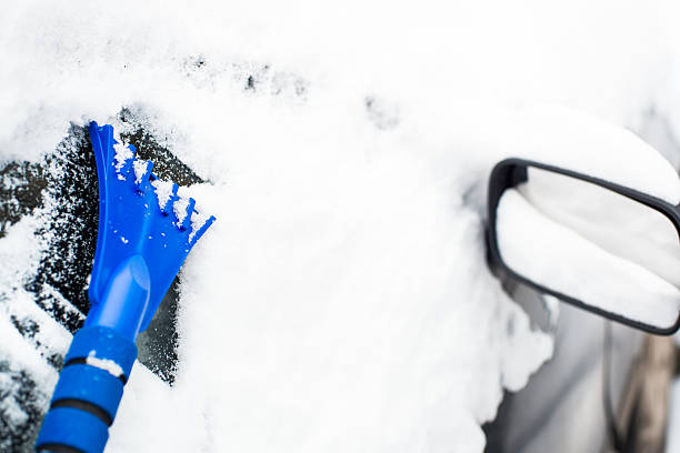 istock Cleaning the glass with ice scraper 160596123