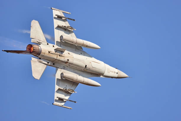 istock F-16 Fighting Falcon. Air force fighter jet plane in full flight 1605967587