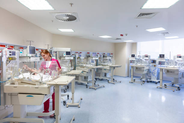 istock Babies and nurse in a special baby care unit. 1605984525