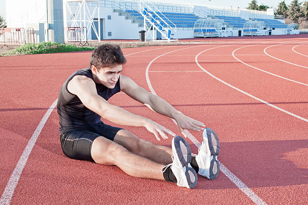 istock Young man makes an athlete stretching. Against the background 160601088