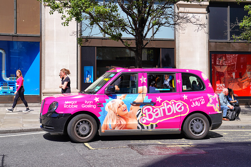 Barbie Movie Black Cab Advertising - August 2023 - Selfridges on Oxford Street, London. A general view of a London black cab decorated with advertising for the Barbie movie on Oxford Street in Central London, England, UK in August 2023. The Barbie film. Credit: Can Aksoy, UK, England, London, Oxford Street.

About The Location: Selfridges Oxford Street is an Upscale department store stocking designer & popular clothing brands plus housewares & gifts. Summer day on Oxford Street, London, England, United Kingdom. Captured in August 2023.

Address: 400 Oxford St, London W1A 1AB, United Kingdom