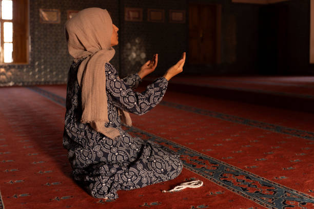 istock Woman Muslim praying in a mosque. 1606058116